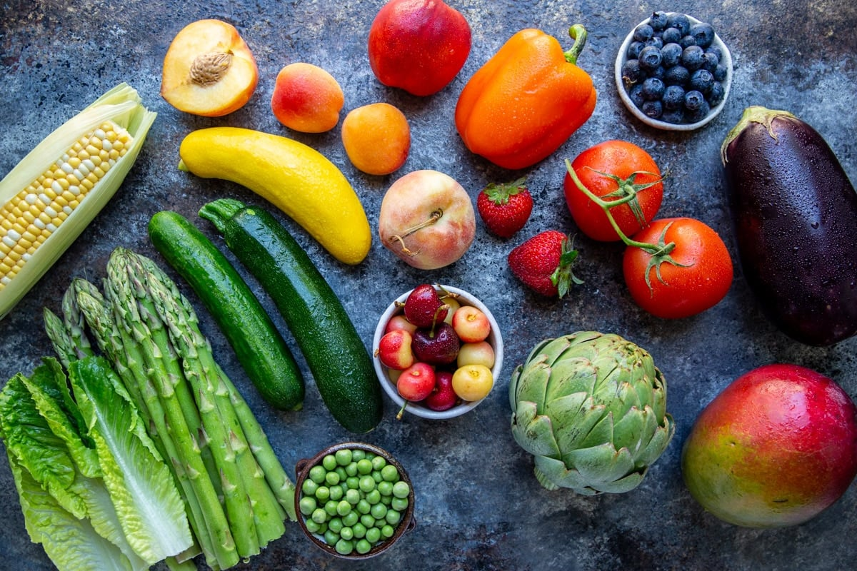 fruits and vegetables on a blue table.